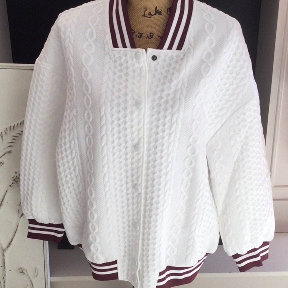 Oversized lightweight team color jacket perfect for cool mornings.
